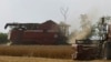 Combines harvest wheat in a field in the Zaporizhzhia region