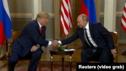 Дональд Трамп и Владимир Путин на встрече в Хельсинки, Финляндия, 16 июля 2018 года